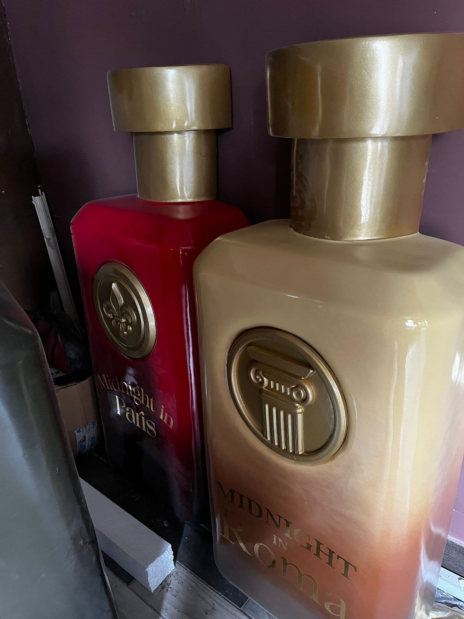 Finished oversized cosmetic bottle display props for a commercial brand presentation